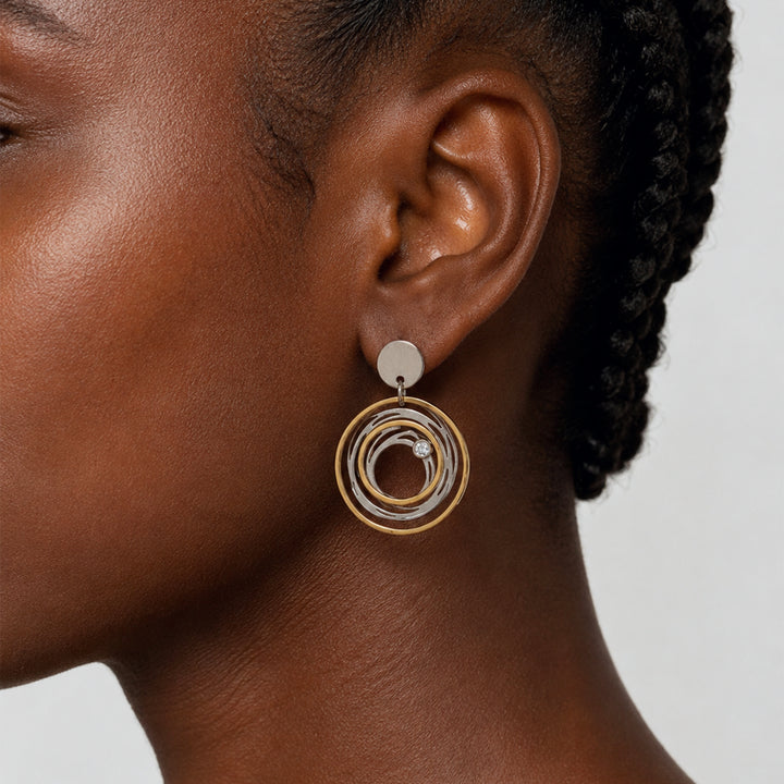 "Swirling waters" earrings, two tone stainless steel